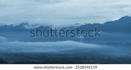 Similar – Image, Stock Photo Mountains covered with fog near lake in Thailand