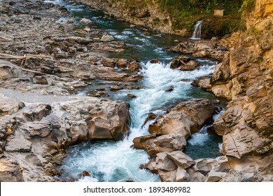 Landscape With A Mountain River Flowing Through Canyon.