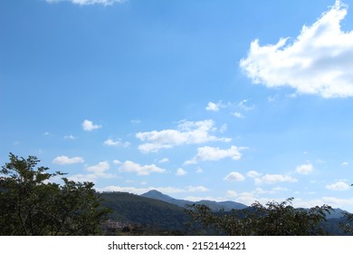 landscape with mountains, blue sky and few clouds