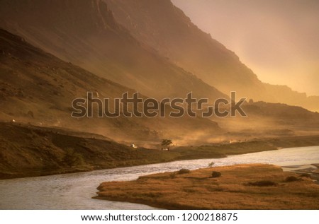 landscape of mountains with dust and rays during jeep rally,
mountains in golden light 
