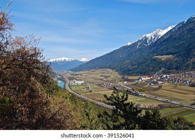 landscape with mountains, fields and river