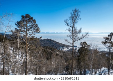 The landscape of mountains at Mongolian border looking through lake Baikal seen from Listvyanka a small town in Irkutsk Oblast on the shores of Lake Baikal, Russia.