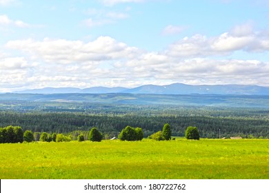 Landscape With Mountains And Scandinavian Village At Summer