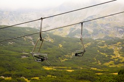 Landscape With Mountains And Two Empty Ski Lifts.