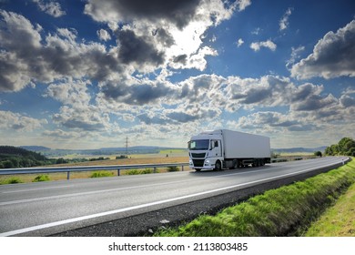 Landscape with a moving truck at sunset