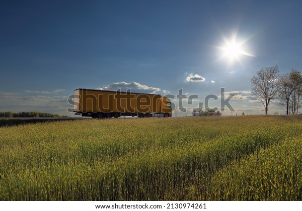 Landscape with a moving
truck at sunset 