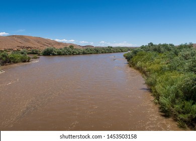 Landscape Of The Muddy Flowing San Juan River Near The Four Corners Monument In Colorado