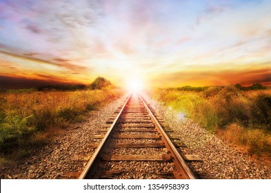 Landscape of an old abandoned railway at the sunrise. Sunny summer day.