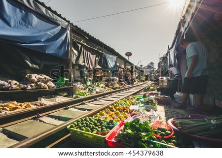 Landscape of outdoor market closed to the railway called Maeklong Market, Thailand.