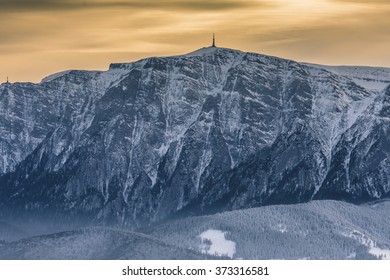Landscape over Bucegi Mountains at sunset in winter season, with view from Postavaru peak.The Bucegi Mountains are located in central Romania, south of the city Brasov. 