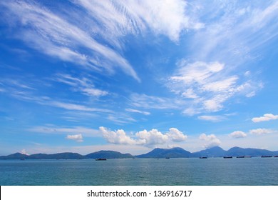 Landscape Over Ocean With Moving Clouds At Day