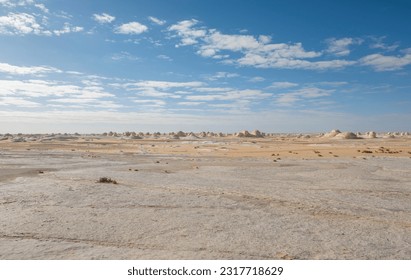 Landscape panoramic scenic view of desolate barren western white desert in Egypt with geological chalk rock formations