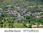 Landscape with panoramic view of Prastos, a traditional historic village and Heritage Site in Arcadia Peloponnese Greece with the typical red clay rooftops, surrounded by olive groves.