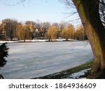 Landscape in the park  Park Staszic Kielce winter - frozen water on the pond.

