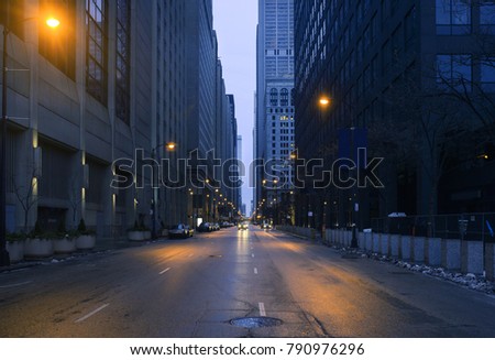 A landscape phot of downtown Chicago. The shot is taken from the middle of the street.