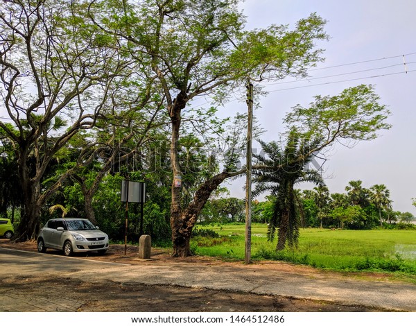 Landscape photo of  village in West Bengal,\
Kolaghat, West Bengal, India, Asia , Summer season, Afternoon time,\
May , 2019, Long drive with car\
