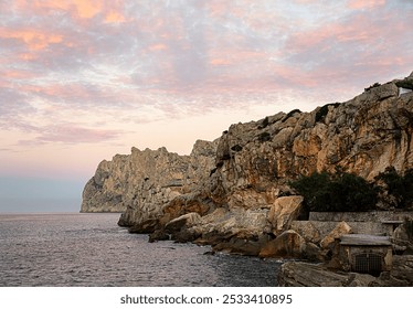 Landscape photography of cliffs and sunset, rocky coast, The Mediterranean Sea, tourism, vacation, Spain, Mallorca, Cala San Vicente - Powered by Shutterstock