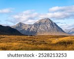 Landscape photography of mountain Buachaille Etive Mor, Glencoe, Scotland, UK, hiking, valley; trail; viewpoint; scenic; rocky hill,  blue sky with clouds, travel