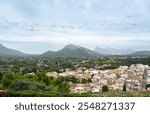 Landscape photography of mountains and resort town Pollenca, holiday destination, houses, tourism, vacation, Spain, Mallorca