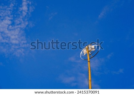 Landscape Photography. Landscape View. TV antenna with bamboo pole. A TV antenna with a blue sky background. Bandung, Indonesia
