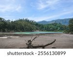 Landscape picture of a Telaga Warna, a geothermal lake in Dieng Plateau, Central Java Indonesia.