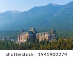 Landscape of pine tree forest with Banff Springs Hotel facade, Banff national park, Alberta, Canada.