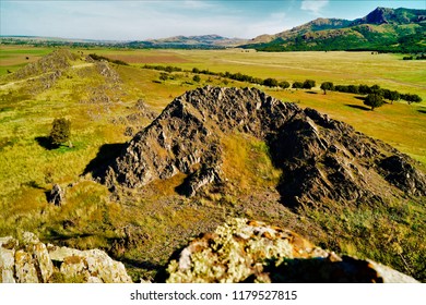 Landscape of the plain with mountains in the second plan under the clear blue sky