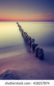  Landscape Polish Sea Shore With Breakwaters. Sunrise Over The Sea.