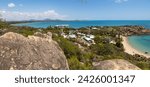 Landscape of Queens Bay and Horseshoe Bay from a lookout looking over granite scenery, the coastline, and some suburbs of the town of Bowen in the Whitsunday region of tropical Queensland, Australia.