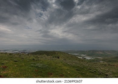 landscape in rainy weather, a group of people far away 