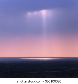 landscape rays of the sun through the clouds over the sea