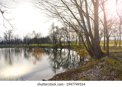 Landscape With Reflection In Water. Series. Beautiful Noon Over Calm Lake In Gorj  Targu Jiu County. After Sunset Sky Reflecting In Water, Calm Vibrant Landscape. Moi Lake Or Lacul Moi.