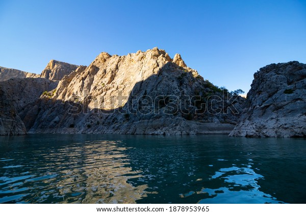 Landscape of the river\
and hills. Cliffs of the canyon. Boat tour on the river. Canyon\
background photo.