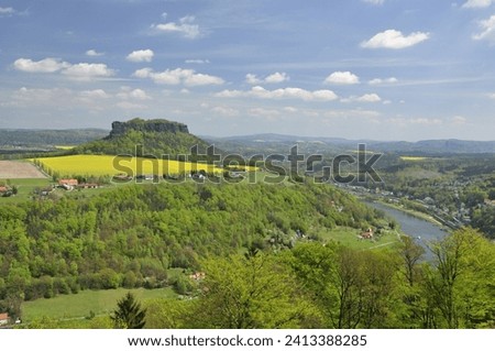 Landscape with river and riverbanks, nature and city
