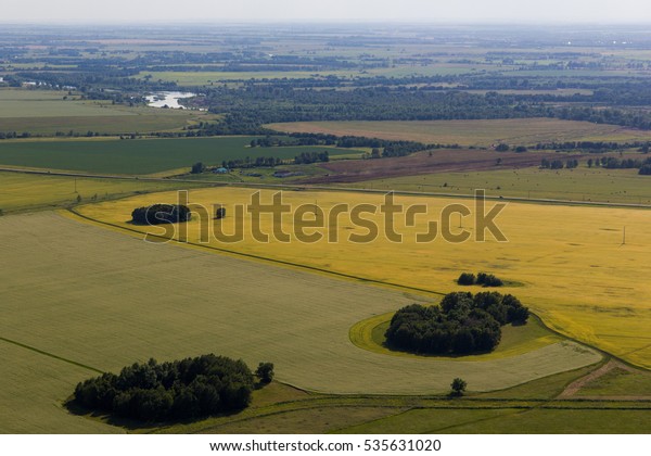 Landscape with road, houses, trees, fields. View\
from mountain Toratau