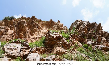 Landscape Of Rock Mountains At Aravalli Range Against Cloudy Sky