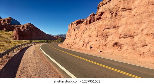 landscape rock red road desert valley - Shutterstock ID 1209951601
