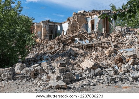 Landscape of ruined buildings, image of decrepitude or natural disaster. The house is destroyed. Destruction of old houses, earthquakes, economic crisis, abandoned houses. Broken unfit house