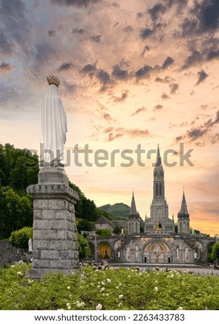 Landscape of the sanctuary of Our Lady in Lourdes at sunset, France -  Religious tourism concept