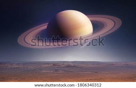 Landscape with saturn planet in sky with stars. Fantasy space wallpaper with planet over the land. Sci-fi. Elements of this image furnished by NASA Stockfoto © 