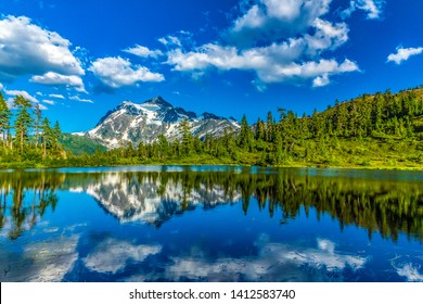 Landscape scene of Mt. Shuksan and its reflection in Picture Lake below. - Shutterstock ID 1412583740