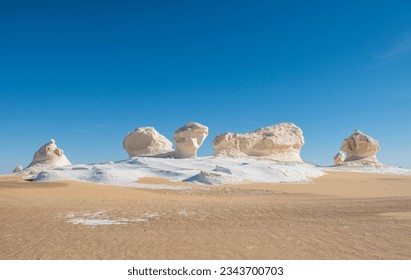 Landscape scenic view of desolate barren western white desert in Egypt with geological chalk rock formations - Powered by Shutterstock