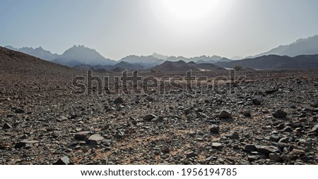 Landscape scenic view of desolate barren rocky eastern desert in Egypt with mountains