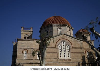 Landscape with scenic view of Panaghitsa a royal church with a large dome and vaulted arches  on the coastal road of Aegina island in Greece. 
