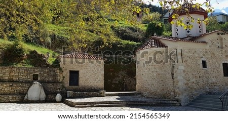Landscape with scenic view of Taxiarches an18th century stone built Greek Orthodox church in Sitaina, Arcadia Peloponnese, Greece. 