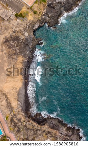 Similar – Aerial Drone View Of Dramatic Ocean Waves Crushing On Rocky Landscape