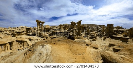 A landscape shot of multiple different rock and hoodoo formations in the Valley of Dreams, New Mexico 