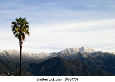 Landscape shot of the Ojai valley with snow on the mountains.