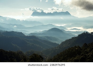 landscape and sky background concept with woman travel, nature of north Thailand, fog-laden valleys, wintery mountain passes of Chiang Mai province,  top view on the mountain sunrise and sunset