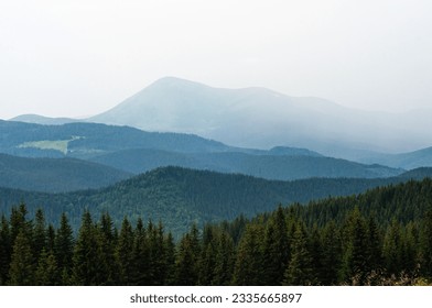 landscape the sky before a thunderstorm, clouds in the mountains before the rain, a cloud is approaching, fog, above the clouds, wallpaper, poster, cover, nature of the Carpathian mountains, green